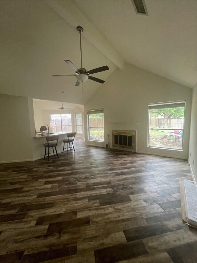living room with ceiling fan, visible vents, high vaulted ceiling, beamed ceiling, and a wealth of natural light