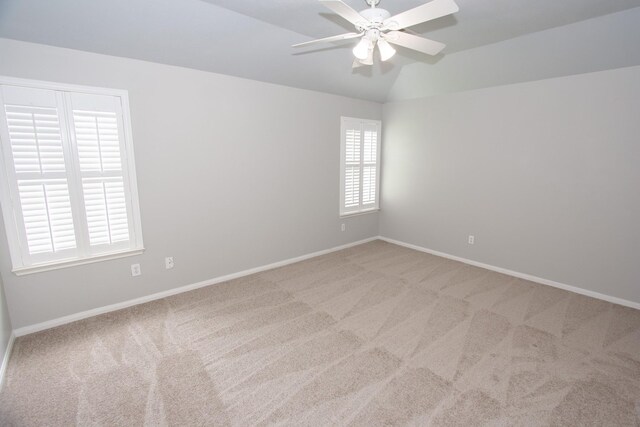 spare room featuring carpet flooring, a ceiling fan, and baseboards