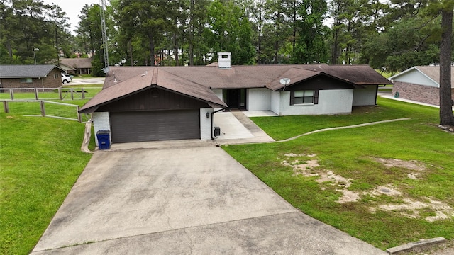 view of front facade featuring a garage, a front lawn, fence, brick siding, and concrete driveway