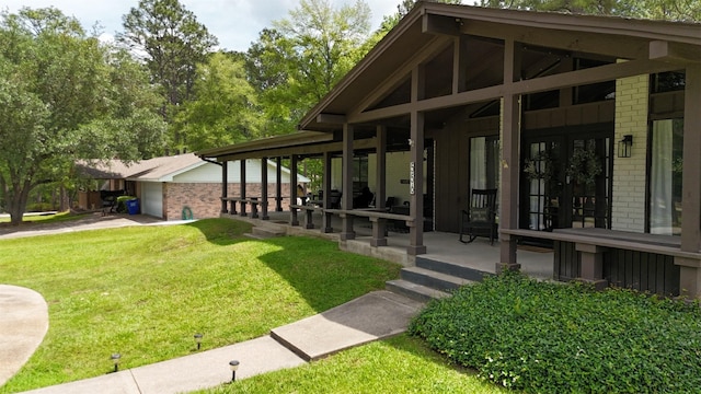 view of home's community featuring a lawn and a garage
