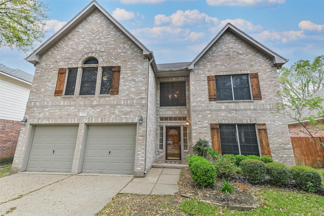 view of front of home featuring brick siding, driveway, and a garage