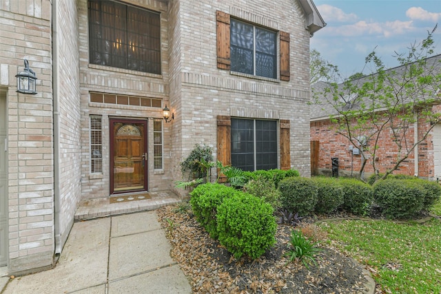 entrance to property with brick siding
