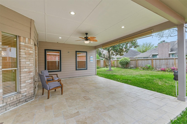 view of patio / terrace with a fenced backyard and ceiling fan