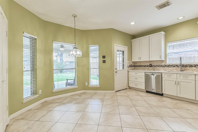 kitchen with decorative backsplash, visible vents, dishwasher, a sink, and light countertops