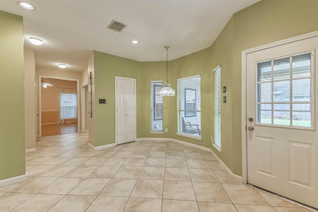 entryway featuring visible vents, light tile patterned floors, baseboards, ceiling fan with notable chandelier, and recessed lighting