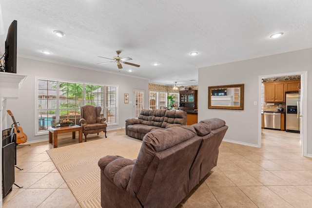 living area featuring crown molding, a textured ceiling, and ceiling fan