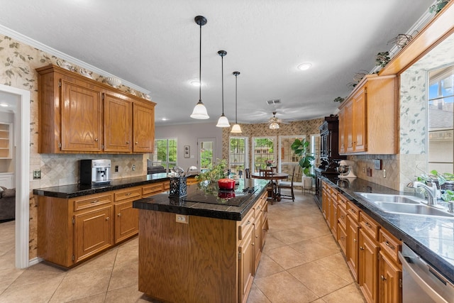 kitchen with ceiling fan, a kitchen island, dishwasher, a sink, and black electric stovetop