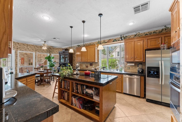 kitchen featuring a textured ceiling, visible vents, open shelves, stainless steel appliances, and light tile patterned flooring