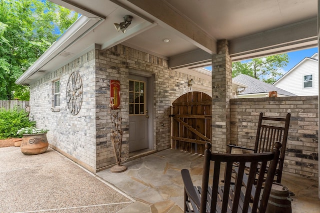 view of patio / terrace featuring a gate and fence