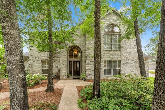 view of front of house with brick siding