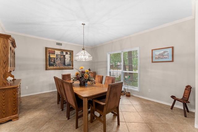 dining space featuring light tile patterned flooring, baseboards, visible vents, and ornamental molding