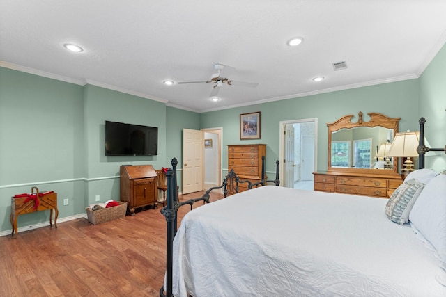 bedroom featuring crown molding, recessed lighting, visible vents, and wood finished floors