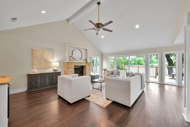 living area with a ceiling fan, a stone fireplace, visible vents, high vaulted ceiling, and beam ceiling