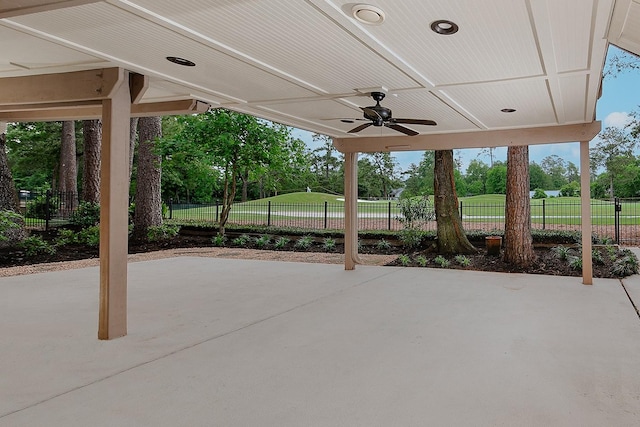 view of patio with fence and ceiling fan