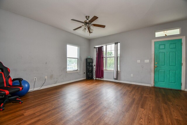 entrance foyer with baseboards, a ceiling fan, and wood finished floors