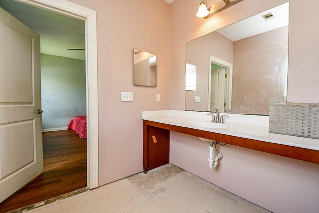 bathroom featuring vanity, concrete flooring, and visible vents