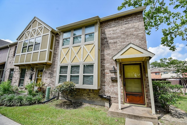 view of front of house featuring brick siding