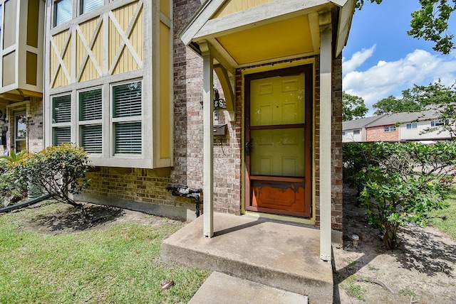 property entrance with brick siding
