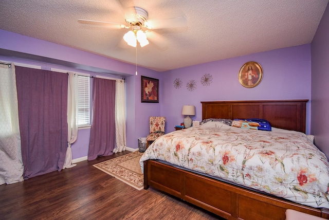 bedroom featuring a ceiling fan, dark wood finished floors, and a textured ceiling