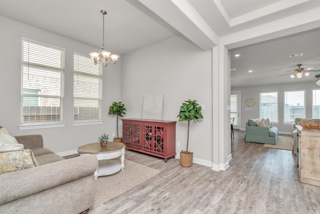 living area featuring visible vents, baseboards, ceiling fan with notable chandelier, recessed lighting, and light wood-style flooring