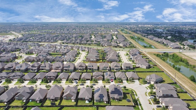bird's eye view with a water view and a residential view