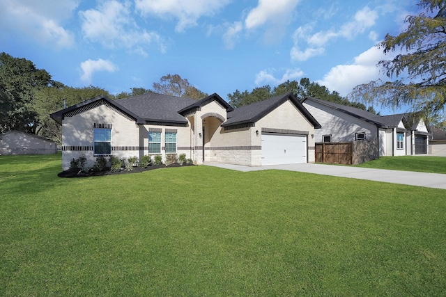 view of front facade with a garage, fence, concrete driveway, and a front lawn