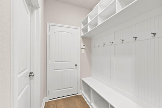 mudroom featuring dark wood finished floors