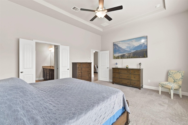bedroom with a ceiling fan, a towering ceiling, visible vents, baseboards, and carpet flooring