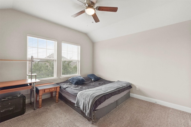 bedroom with baseboards, light carpet, a ceiling fan, and lofted ceiling