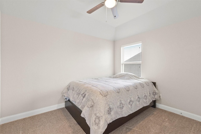 carpeted bedroom featuring a ceiling fan and baseboards