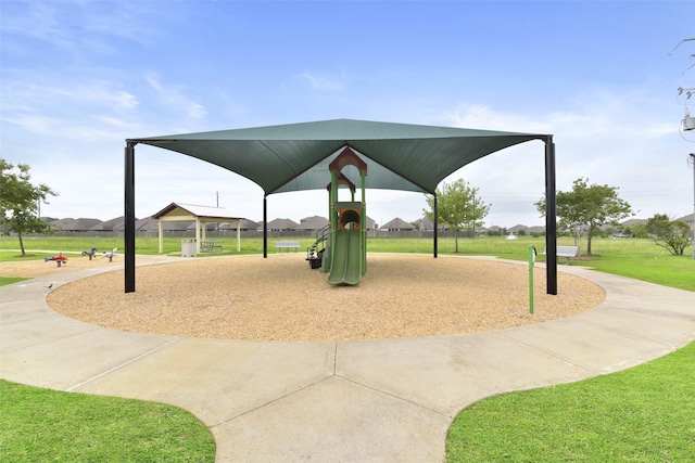 view of community with a yard and playground community