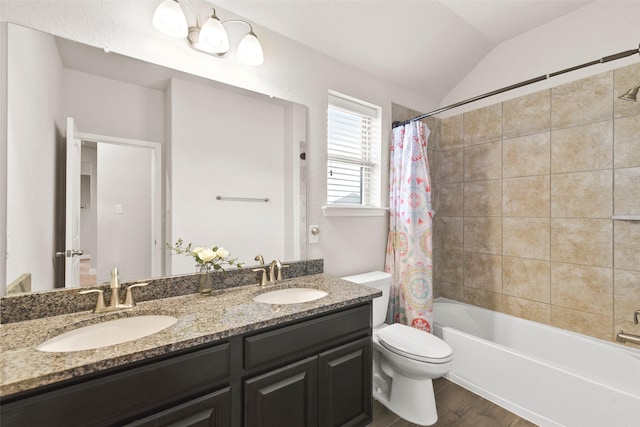 full bathroom featuring double vanity, toilet, a sink, and shower / bath combo