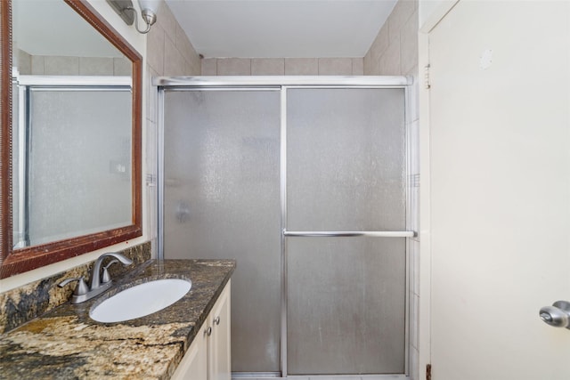 full bath featuring a shower stall and vanity