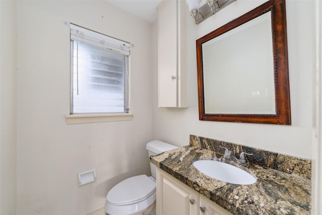 half bath with vanity and toilet