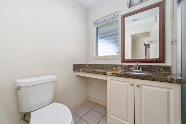 bathroom featuring visible vents, tile patterned floors, baseboards, vanity, and toilet