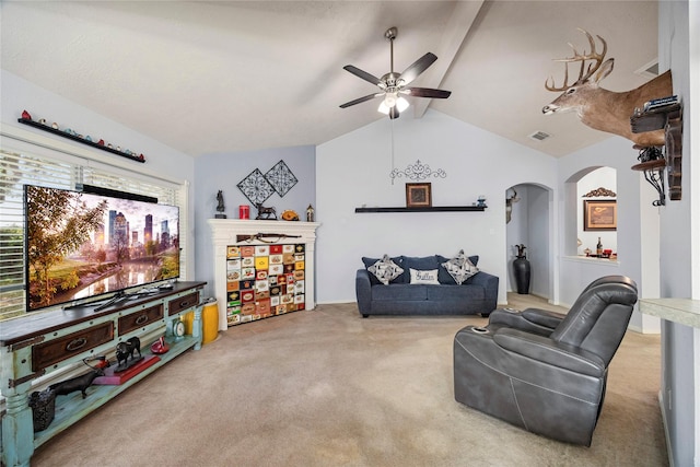 living area featuring visible vents, a ceiling fan, vaulted ceiling with beams, arched walkways, and carpet flooring