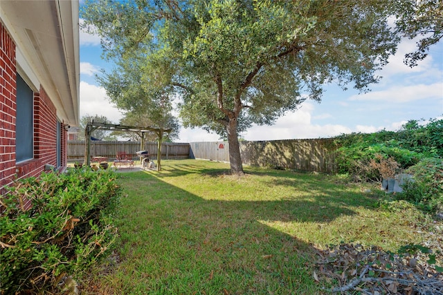 view of yard featuring a patio, a fenced backyard, and a pergola