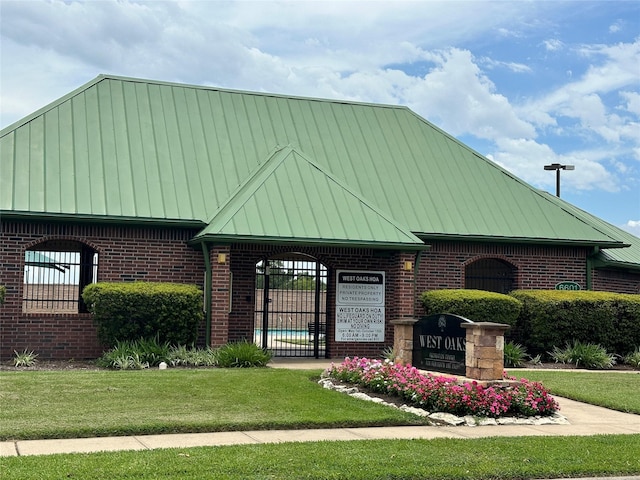 view of community with a lawn and fence