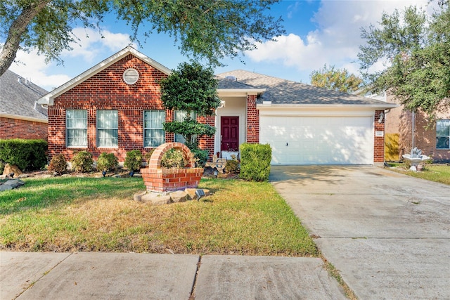 single story home featuring a front yard, roof with shingles, brick siding, concrete driveway, and an attached garage