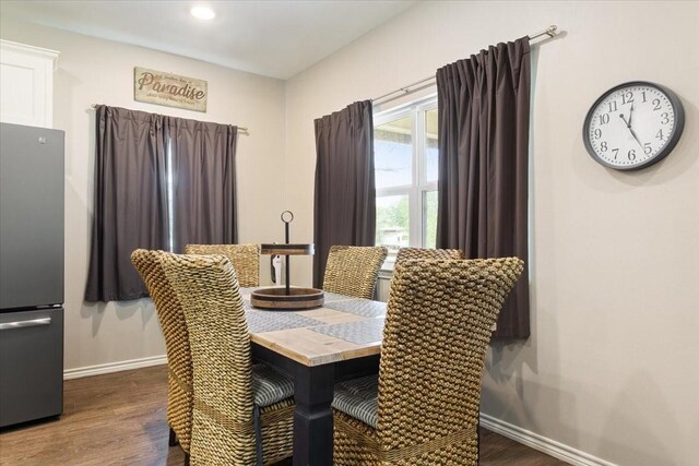 dining space featuring baseboards, recessed lighting, and dark wood-style floors