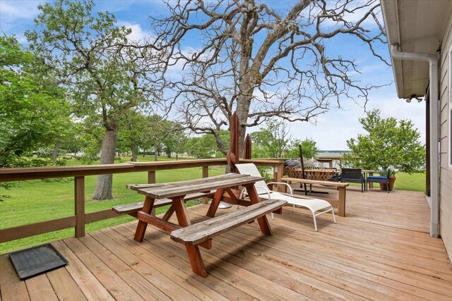 wooden deck with a yard