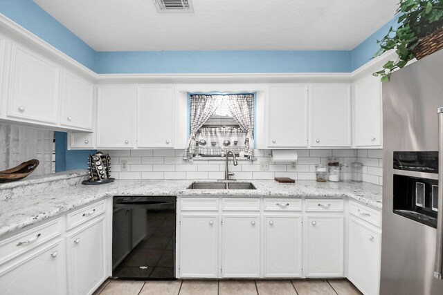 kitchen featuring decorative backsplash, black dishwasher, stainless steel refrigerator with ice dispenser, white cabinets, and a sink