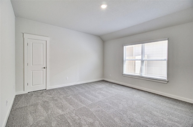 4660 Peony Green Dr, Katy, TX 77493 - carpeted spare room with baseboards and lofted ceiling
