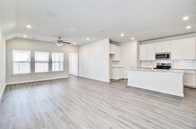 4660 Peony Green Dr, Katy, TX 77493 - kitchen with stainless steel appliances, recessed lighting, decorative backsplash, and light wood-style floors