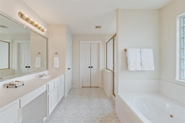 full bath featuring vanity, marble finish floor, a shower stall, visible vents, and a bath