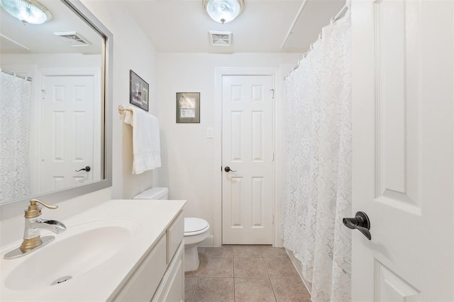 full bathroom with vanity, tile patterned flooring, toilet, and visible vents
