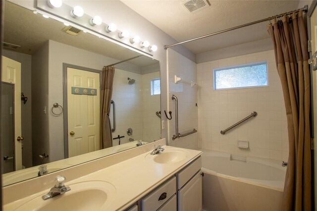 full bathroom featuring visible vents, a sink, and shower / tub combo with curtain
