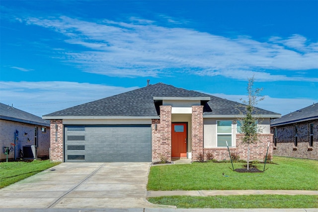 view of front of house with a front yard, roof with shingles, brick siding, concrete driveway, and an attached garage