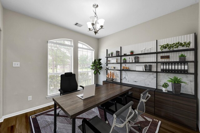 office with an inviting chandelier, baseboards, dark wood-type flooring, and visible vents