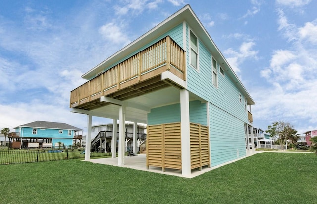 22814 Camino St, Galveston, TX 77554 - back of property featuring fence, a patio, a yard, and a deck
